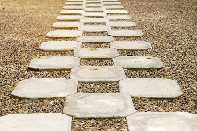 Perspective View of Cement Block Pathway on Gravel Garden Floor