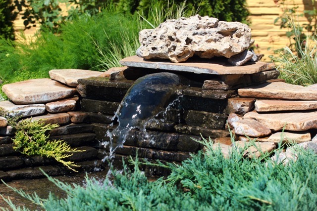 Small rockery with waterfall in a garden