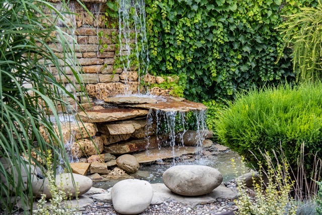 A small decorative waterfall in the Park or in the garden. Landscape design